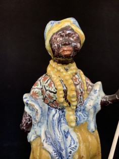 The polychrome figurine of a female servant